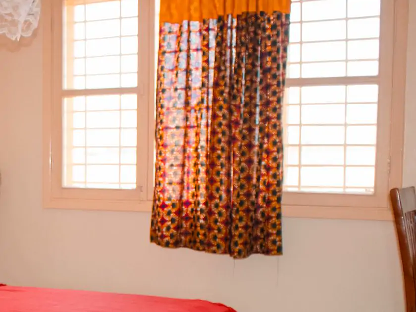 Bedroom 1: windows and doors. The window in its white frame, and the print curtain (sample photo)