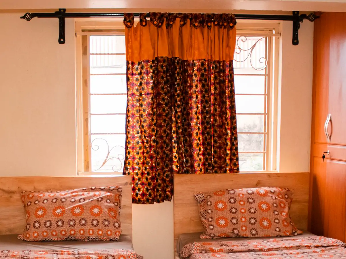 Bedroom 2: the ceiling. The curtain rail and the top of the window above the beds (sample photo)